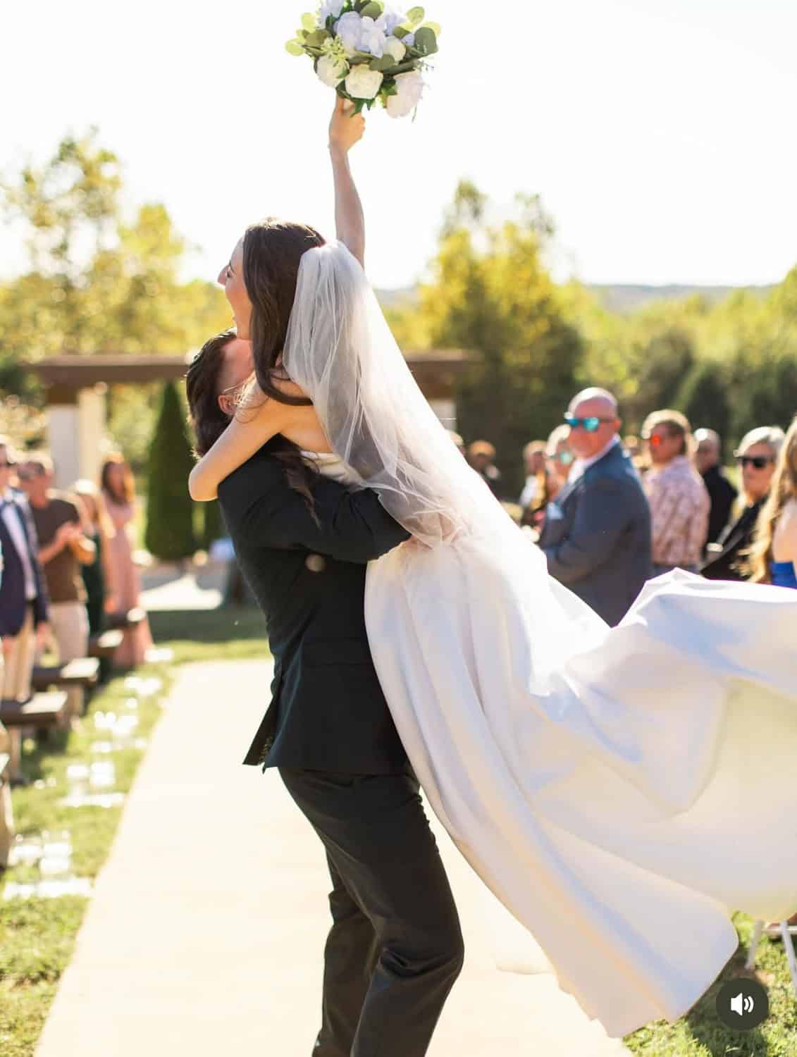 Bride and groom celebrating at Mountain Ridge Venue outdoor wedding.