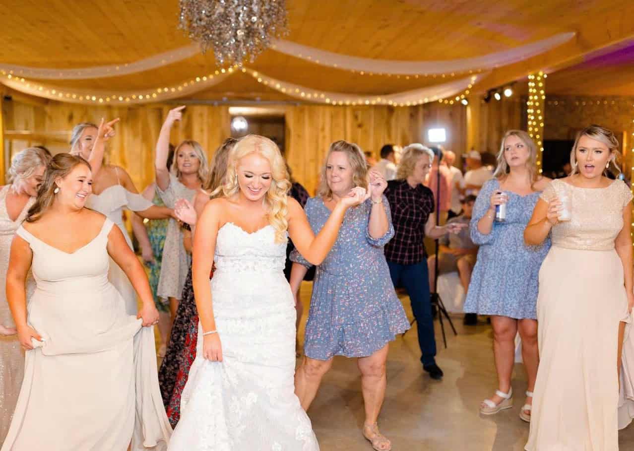 Guests dancing at a wedding reception at Mountain Ridge Venue.