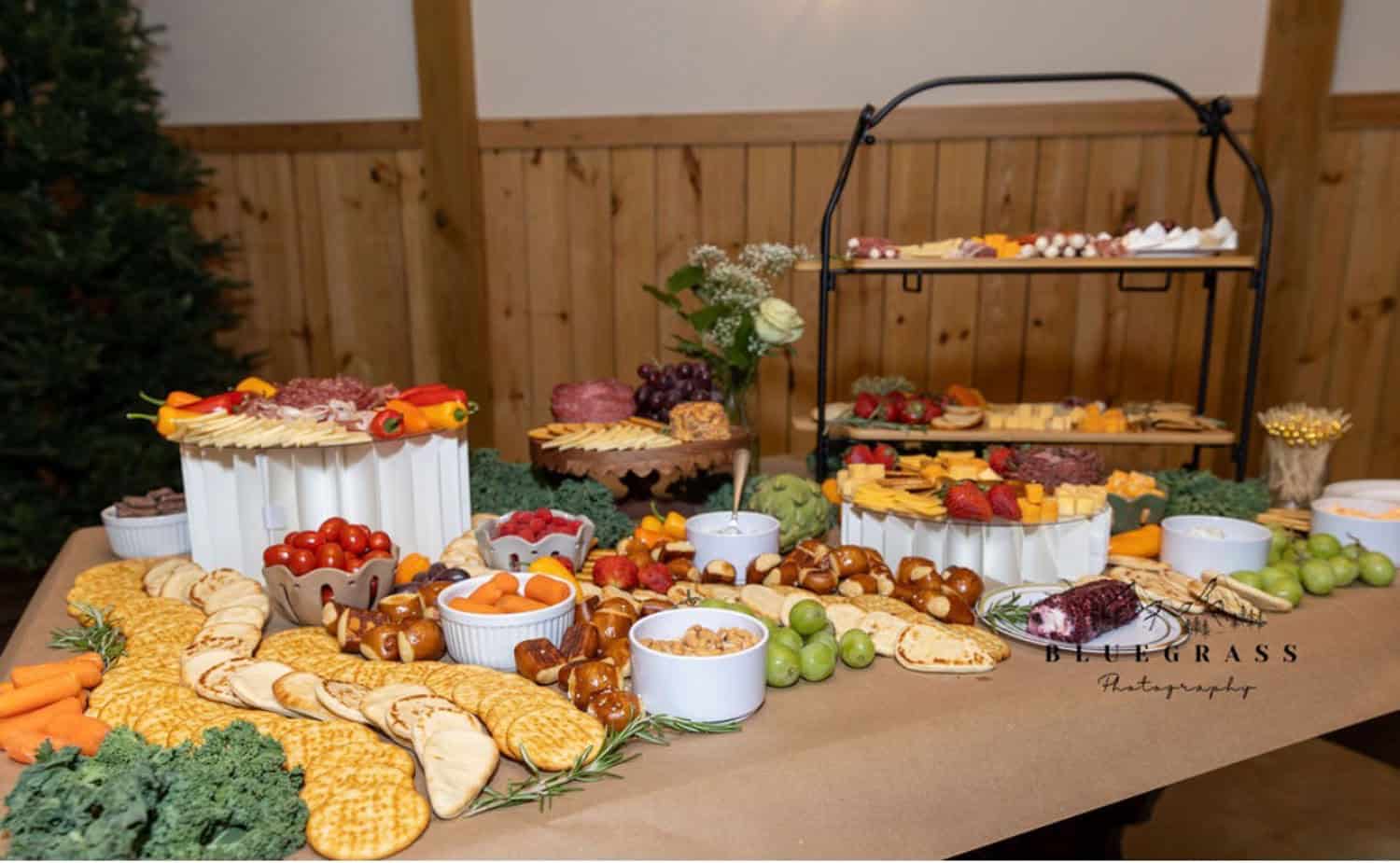 Elegant dessert table at Mountain Ridge Venue with cookies, fruits, and sweets.