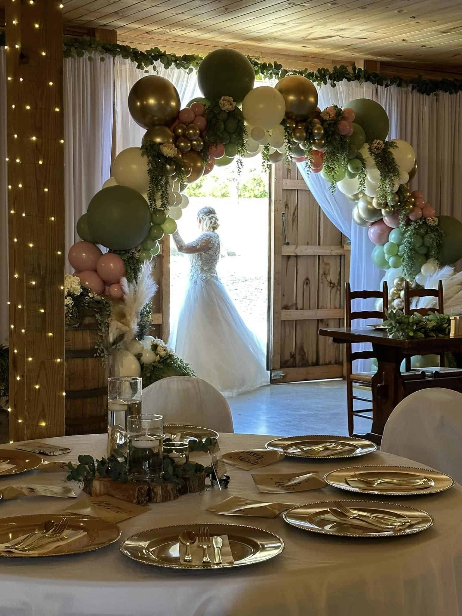Elegant wedding arch with balloons at Mountain Ridge Venue.