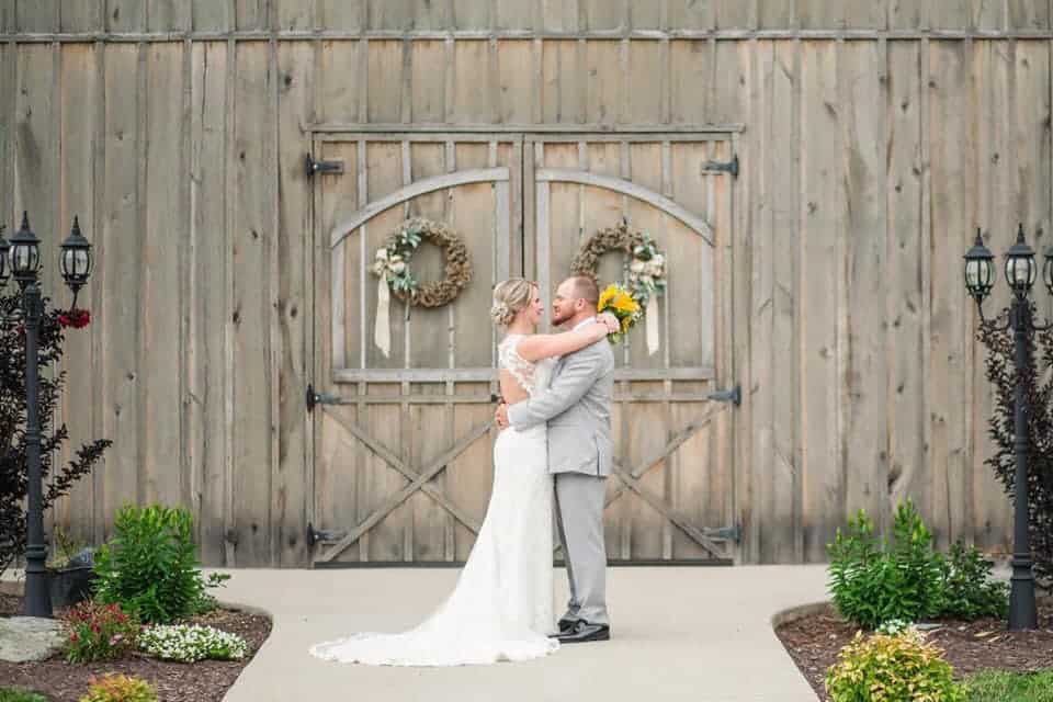 Bride and groom sharing a kiss at Mountain Ridge outdoor wedding venue.